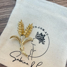 Golden ears brooch