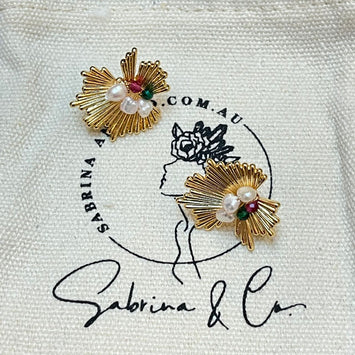 Pearl and gemstones designed earrings