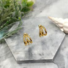 Triple golden hoop earrings
