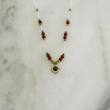 Hanging gemstone necklace