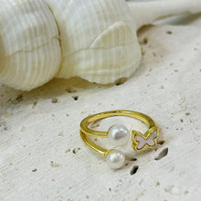 Shell butterfly with double pearl ring