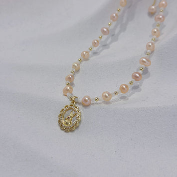 Pink pearl with rabbit pendant