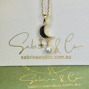 Shell moon with hanging star necklace