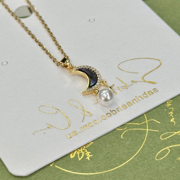 Shell moon with hanging star necklace