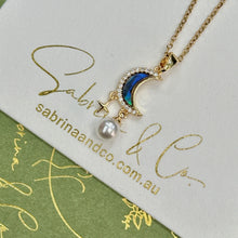 Shell moon with hanging star necklace