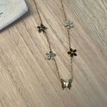 Multiple flowers with butterfly necklace