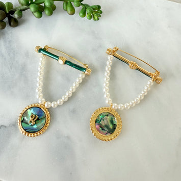 Hanging pearl and shell brooch