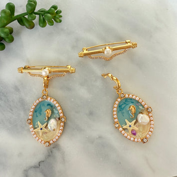 Hanging beach brooch