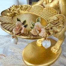 Orange flower with hanging pearl earrings
