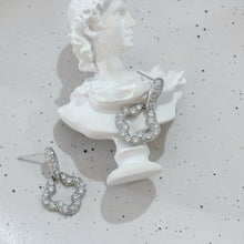 Hanging carved flower earrings