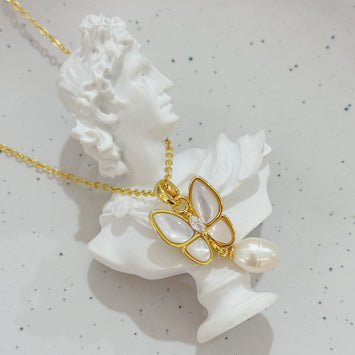 Shell butterfly with pearl necklace