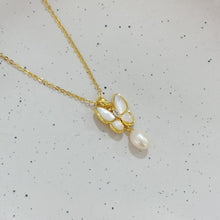 Shell butterfly with pearl necklace