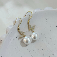 Hanging butterfly pearl earrings