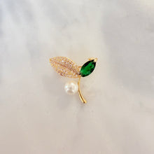Small brooches