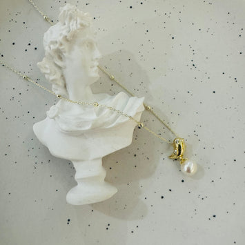 Bird and pearl necklace