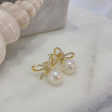 Bow and pearl earrings