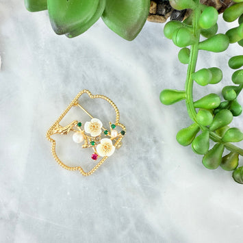 Carved spring brooch