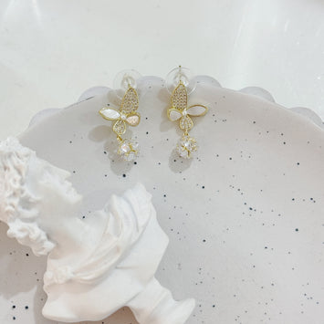 Shell butterfly with hanging diamond earrings