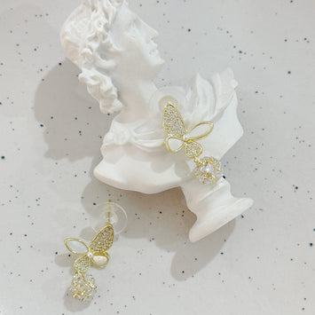 Shell butterfly with hanging diamond earrings