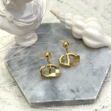 Golden letter CD earrings