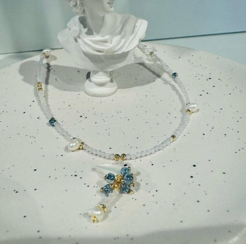 Hanging shell bird with pearl necklace