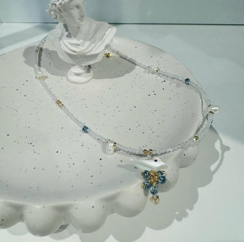 Hanging shell bird with pearl necklace