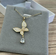 Pearl butterfly with hanging diamond necklace