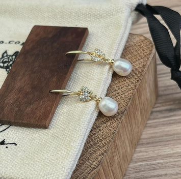 Butterfly with hanging pearl earrings