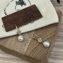 Butterfly with hanging pearl earrings