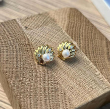 Shell with pearl earrings