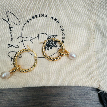 Golden hoop with hanging pearl earrings