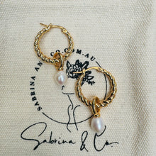 Golden hoop with hanging pearl earrings