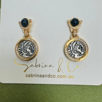 Black stone with hanging human face earrings