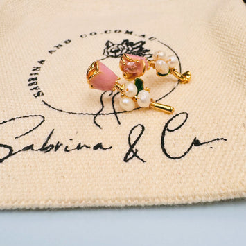 Rose with pearl earrings