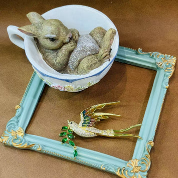 Bird with leaf brooch