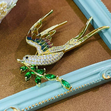 Bird with leaf brooch