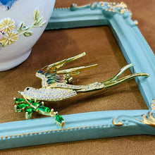 Bird with leaf brooch