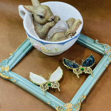 Shell butterfly with green stone brooch