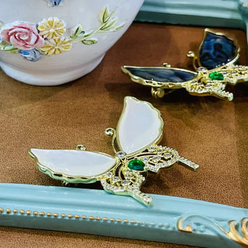Shell butterfly with green stone brooch