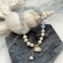 Hanging gold cloud with aquamarine bracelet