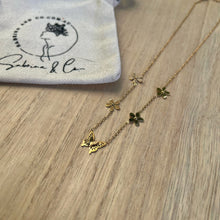 Multiple flowers with butterfly necklace